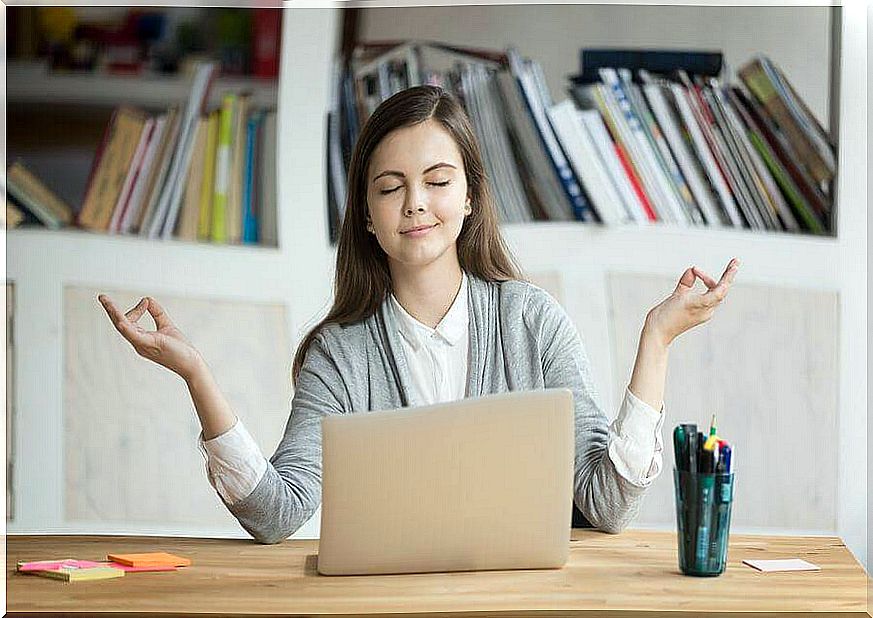 A woman doing meditation at work