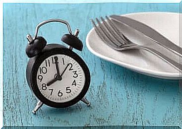 An alarm clock and a plate.