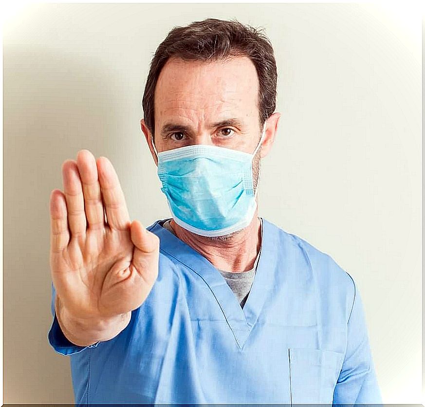 A doctor having a mask to protect himself from the flu